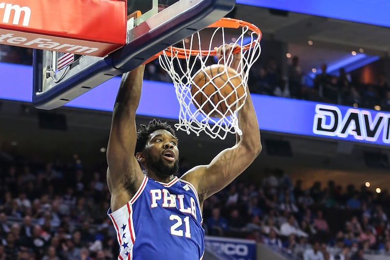 Sixers' Joel Embiid dunks against the Nets during the 3rd quarter of Game 5 of the first round of the NBA playoffs at the Wells Fargo Center in Philadelphia, Tuesday, April 23, 2019. Sixers beat the Nets 122-100 to win the first round of the playoffs (4-1).