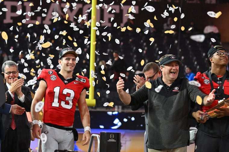 Georgia quarterback Stetson Bennett and head coach Kirby Smart celebrate their victory in the 2023 College Football Playoff national championship, which saw plenty of betting action.