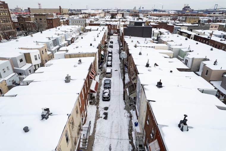 Emily Street is still covered in snow near Furness High School (top left) on Wednesday, Jan. 28, 2026 in South Philadelphia.