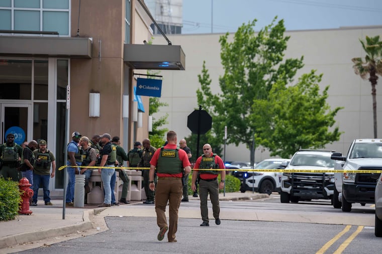 Law enforcement personnel respond to a shooting Thursday at the Mall of Louisiana in Baton Rouge.