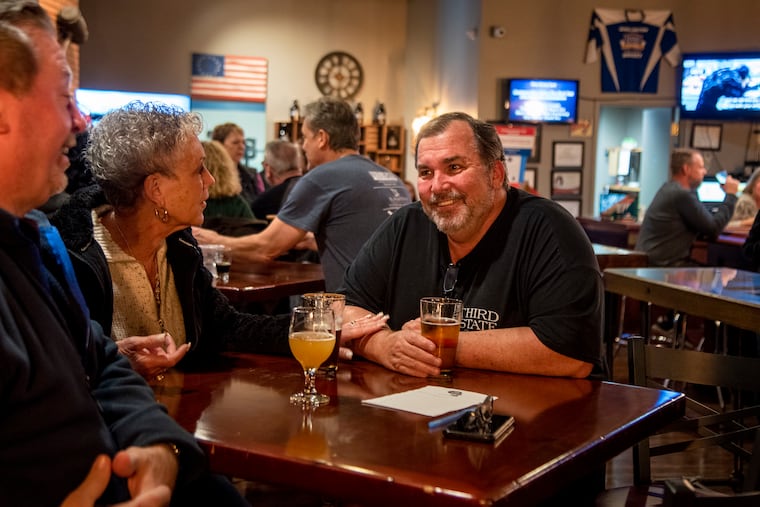 Jay Mahoney (right) the owner of Third State Brewing in downtown Burlington City, said that now that Gov. Phil Murphy has signed a law easing restrictions on breweries, the future looks a little better.