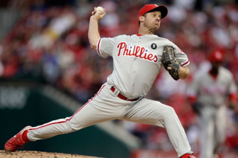 Despite allowing seven hits, Roy Oswalt only gave up one run in five innings. (Jeff Roberson/AP)