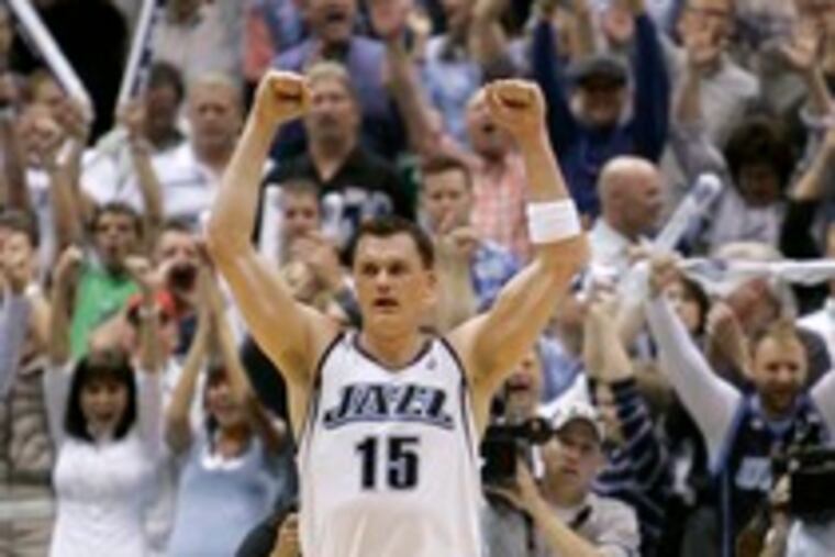 Matt Harpring rejoices after Utah beat the Golden State Warriors in Salt Lake City in Monday's opener of the Western Conference semifinals.