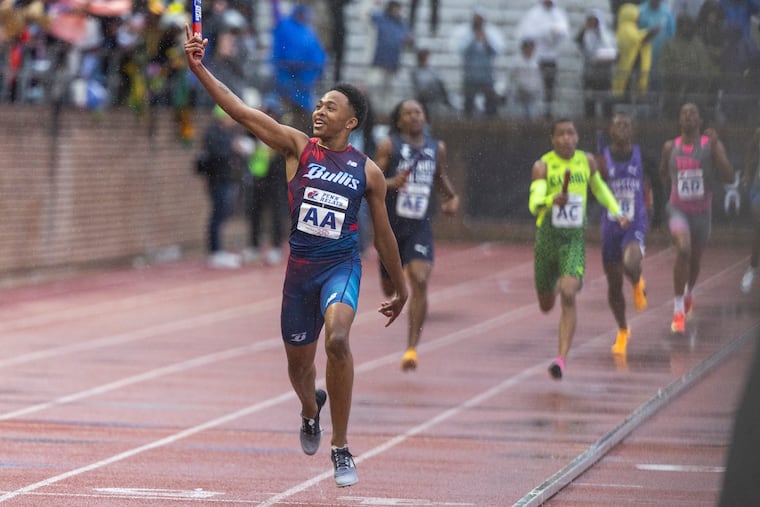 Quincy Wilson celebrates after leading Bullis to a historic triumph in the high school boys' 4x400-meter Championship of America race at the Penn Relays.