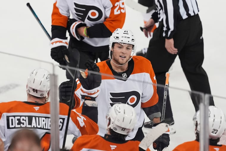 Flyers forward Tyson Foerster celebrates with his teammates after notching his first career hat trick on Wednesday vs. the Rangers.