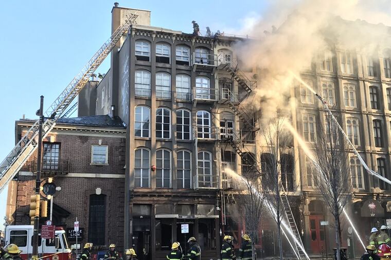 Among the restaurants damaged by fire were The Little Lion at far left, Revolution Diner, Capofitto, and the nearby Gina’s 45.