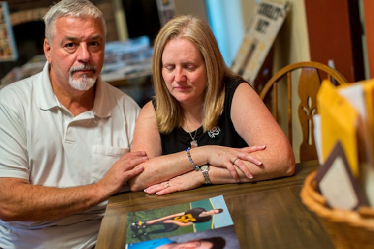 John and Kathleen Kocher look over pictures of their son, Matthew, who drowned in Lake Michigan recently in a rip tide. Internet trolls hijacked the Facebook page dedicate to Matthew's memorial posting rude comments about him and his death. (Zbigniew Bzdak/Chicago Tribune/MCT)