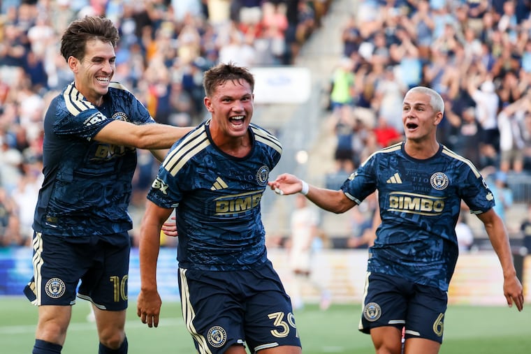 Union forward Milan Iloski (left) celebrates with teammates Frankie Westfield (center) and Cavan Sullivan after scoring a goal in the ninth minute against Red Bull New York at Subaru Park on Wednesday.