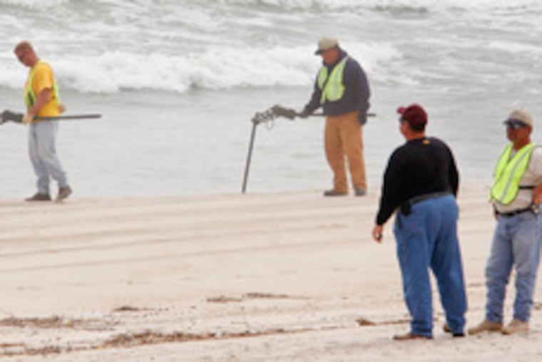 The beaches are closed in Surf City, N.J., while a crew searches for unexploded ordnance that a beach-replenishment project brought ashore. Officials say they believe the rusty munitions were dumped offshore decades ago and then sucked up by a dredge.