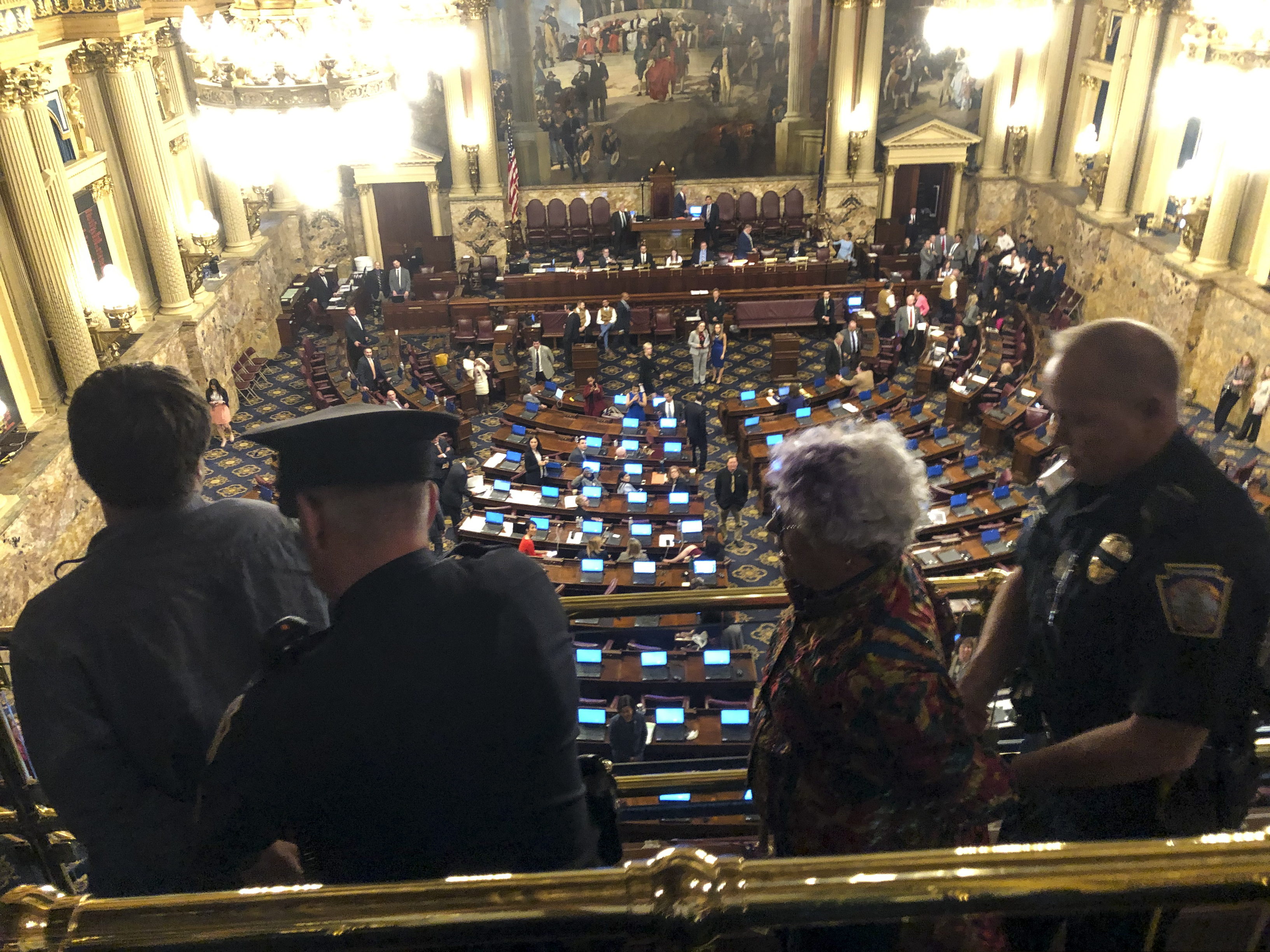 Demonstrators protesting a Pennsylvania law that doesn't limit how much in gifts state lawmakers may accept from people seeking to influence them are arrested and led out of the House of Representatives' chamber in the state Capitol in Harrisburg, Pa., Monday, May 6, 2019. (AP Photo/Marc Levy)