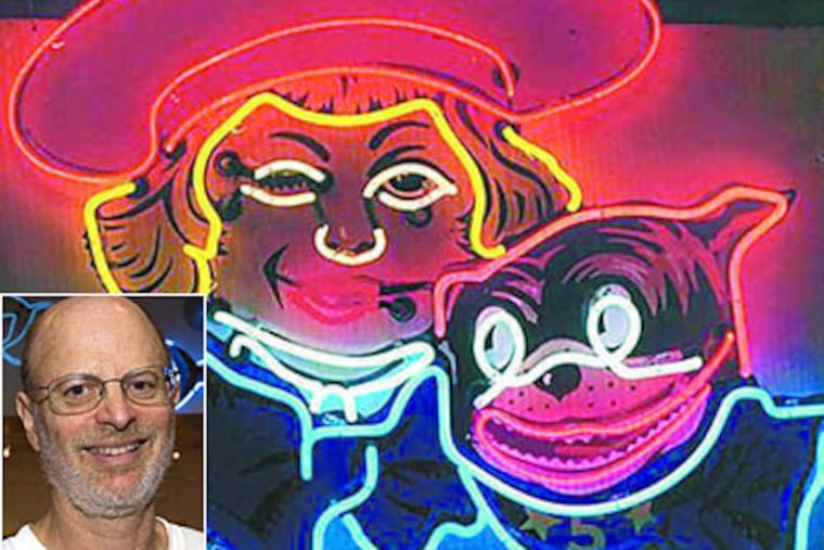 Neon artist and historian Len Davidson (inset) has a particular love for the funkier signs that depict people and things. This Buster Brown sign hung outside Weinstein Shoes on Suoth Street in the '50s.