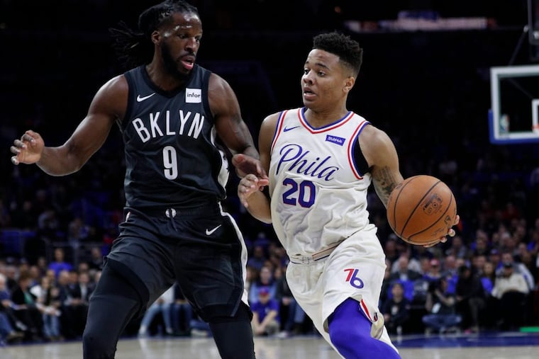 Markelle Fultz, right, drives to the basket against Brooklyn’s DeMarre Carroll during the first half Tuesday.