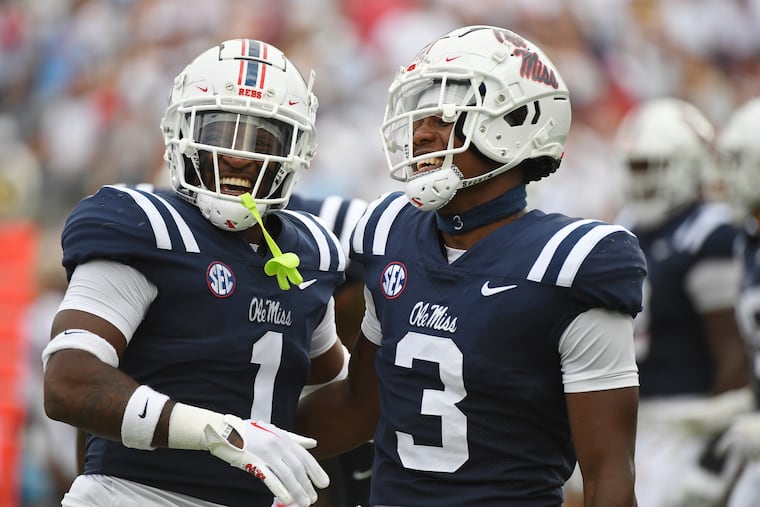 Mississippi safety Isheem Young (1), celebrating with fellow safety safety Otis Reese after a play against Troy in September, had a long road to the Rebels.