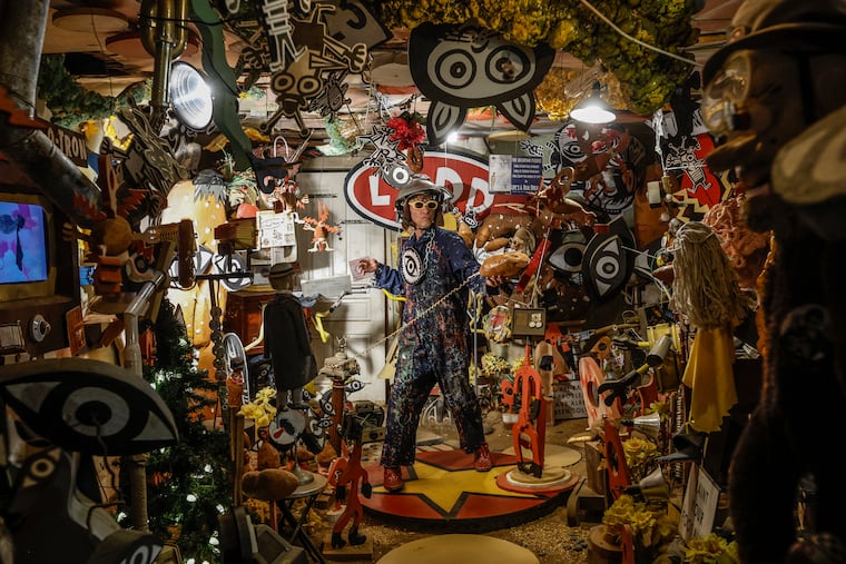 Artist Steven Erdman takes a call on one of his yamophones inside of the Yamatorium.