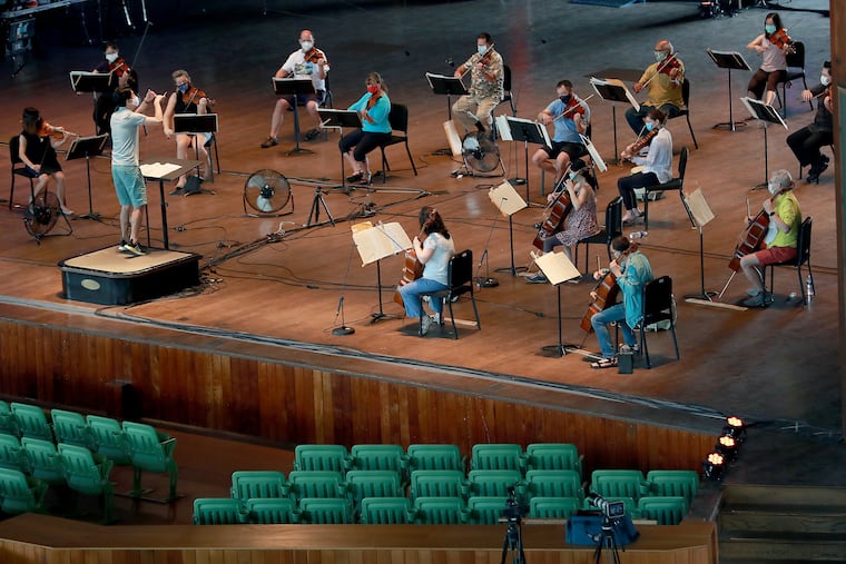 Conductor Kensho Watanabe led 25 strings from the Philadelphia Orchestra in rehearsal at the Mann Center in August in preparation for a performance to be streamed Sept. 8 as a preview to the orchestra's 2020-21 season.