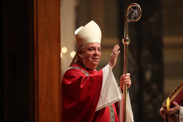 Archbishop Nelson Pérez gives his blessing at the end of Palm Sunday mass at the Cathedral Basilica of Saints Peter & Paul in Philadelphia, PA on April 5, 2020. The Cathedral Basilica of Saints Peter & Paul was closed to the public to help stop the spread of the corona virus.