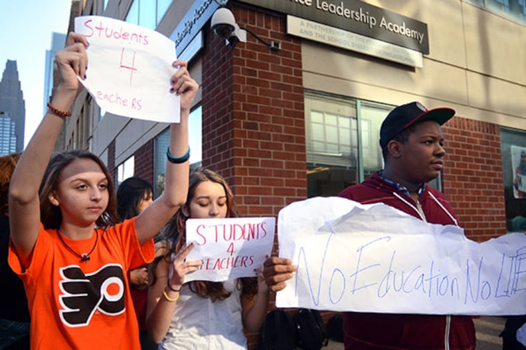 Sophomores Juliana Concepcion and Isabel Medlock and junior Kevin Horton at Science Leadership Academy in Center City joined those at other district magnet schools in a strike Wednesday morning in support of teachers after new contract terms were imposed by the SRC. ( TOM GRALISH / Staff Photographer )