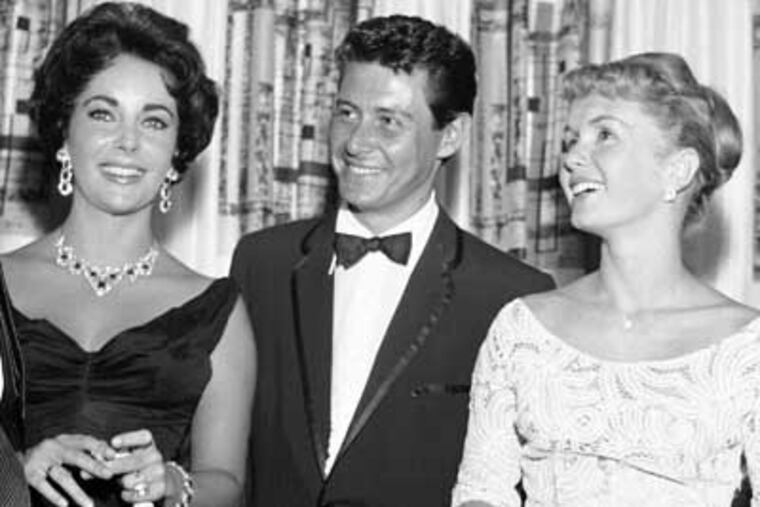 Singer Eddie Fisher, a South Philly native, whose huge fame as a pop singer was overshadowed by scandals ending his marriages to Debbie Reynolds, right, and Elizabeth Taylor, left. File. (AP Photo/File)