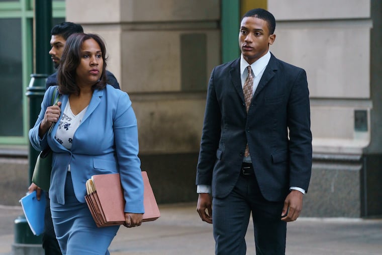 Michael White, right, arrives at the Stout Criminal Justice Center in Philadelphia with Chief Defender Keir Bradford-Grey. White is on trial in the fatal stabbing of Sean Schellenger in July 2018 near Rittenhouse Square.