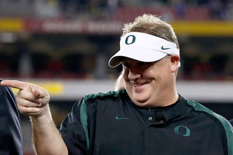 The Eagles have hired Chip Kelly as their new coach. (Ross Franklin/AP)