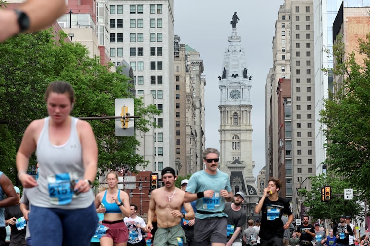 Runners approach South Street during the Independence Blue Cross Broad Street Run on Sunday.