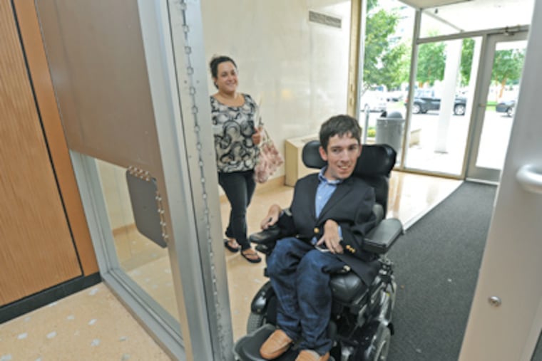 At Park Towne Place, Jimmy Curran checks out an apartment with his sister, Adrian. (April Saul / Staff Photographer)