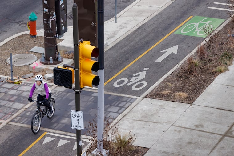 Cyclists on the bike path on Delaware Avenue as seen from Market Street overpass to I-95 in Philadelphia.