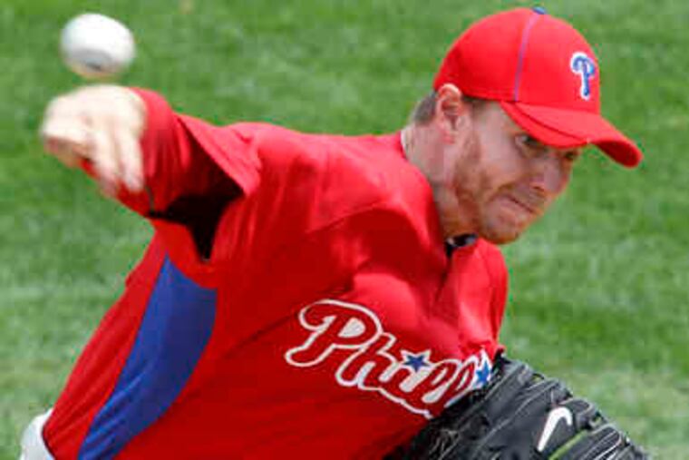 Phillies pitcher Roy Halladay delivers against the Pirates in a spring training game in Bradenton, Fla. Halladay allowed his first run of the spring, struck out six, and walked two in the 5-1 Grapefruit League win. Story, E3.