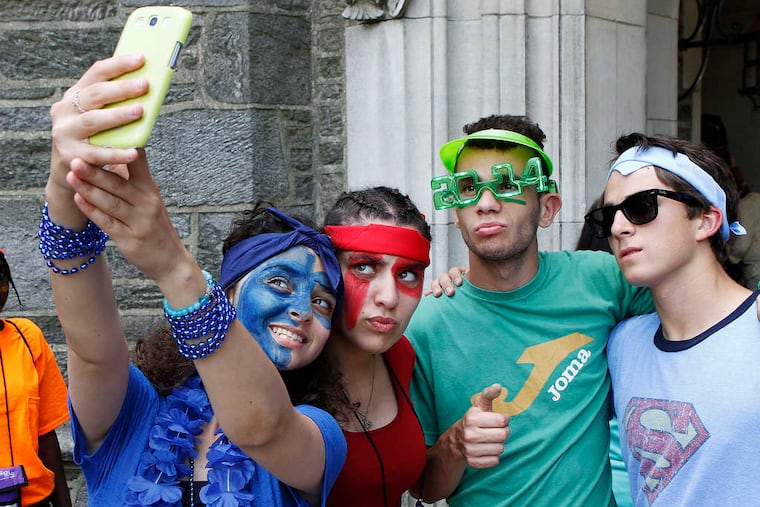 Palestinian Sarah Abutteen (from left) takes a group selfie with Radja Den Terkin of Algeria, John Candela of New Jersey, and Amine Aissaelbel of Algeria before the Peace Olympics games.