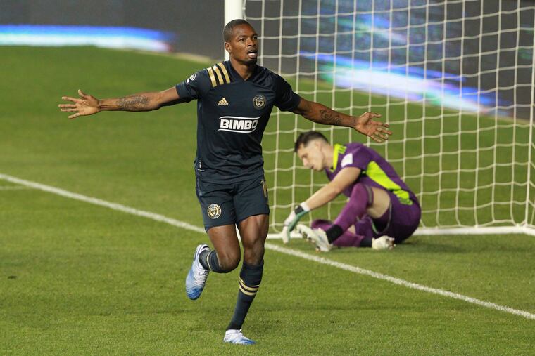 Cory Burke celebrates scoring the game-winning goal for the Union.