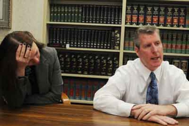 Suspended Holy Family basketball coach John O'Connor at the law firm of Gallagher Malloy & Georges. His wife, Fay, is at his side. (Sarah J.
Glover / Staff Photographer)