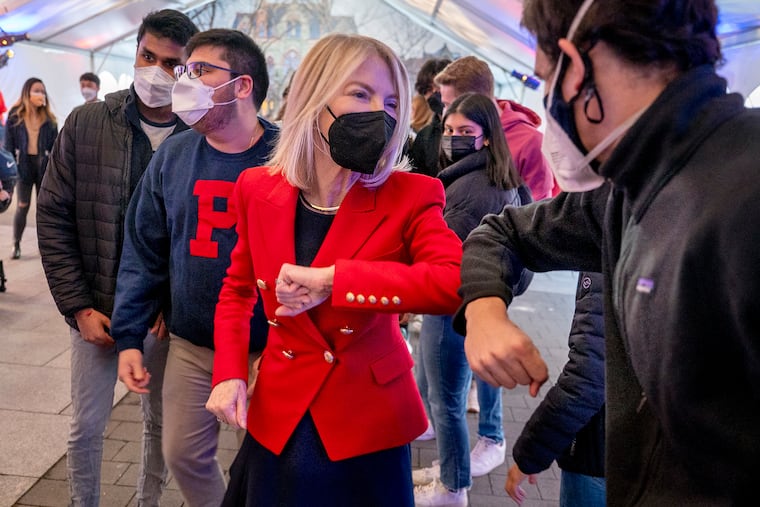 University of Pennsylvania president Amy Gutmann elbow bumps students at a goodbye event on campus Feb. 10, 2022. She will soon leave for Berlin to serve as the U.S. ambassador to Germany