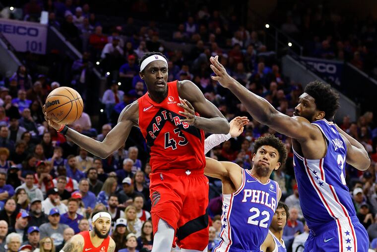 Toronto Raptors forward Pascal Siakam looks to pass the basketball against Sixers guard Matisse Thybulle and center Joel Embiid during the fourth quarter in Game 5.