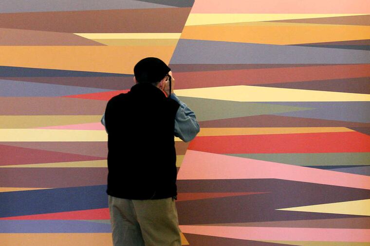 Lou Perri captures an image of "Rift" by Odili Donald Odita at "Represent: 200 Years of African American Art," opening Saturday at the Philadelphia Museum of Art. The exhibition, filling two galleries with 75 works by 50 artists, tells a story of multifaceted and irrepressible creativity and expression. It runs through April 5. Story, B8.