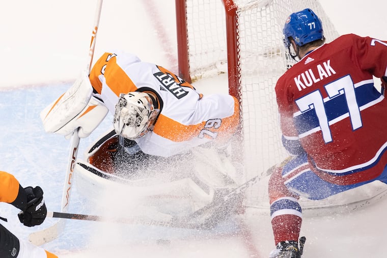 Flyers goaltender Carter Hart (79) makes a save on Montreal Canadiens defenceman Brett Kulak (77) during the second period of Game 4.