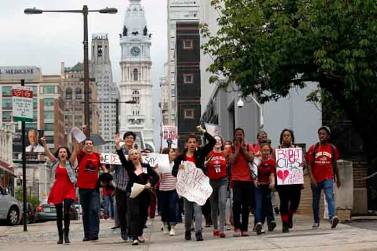 High School students march on the sidewalk towards the Philadelphia School District Headquarters on North Broad Street to protest budget cuts on Tuesday, May 7, 2013. ( Yong Kim / Staff Photographer )