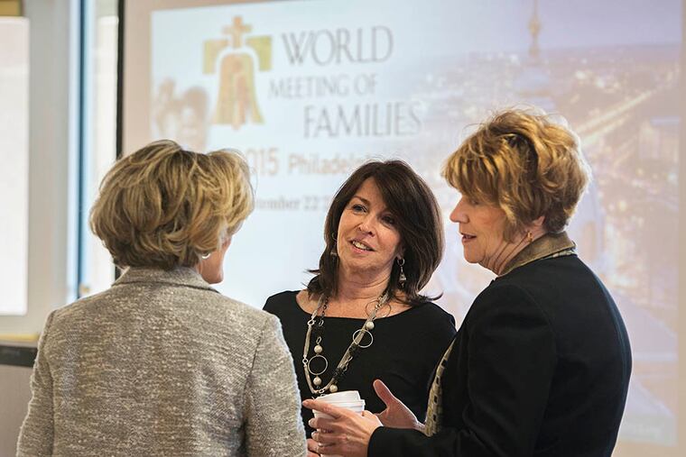 At the event are (from left) Marriane Martelli of the Chester County Chamber of Commerce, Andy Coyle of Visit Philadelphia, and Kathy Baumer of the World Meeting of Families. (ED HILLE/Staff Photographer)