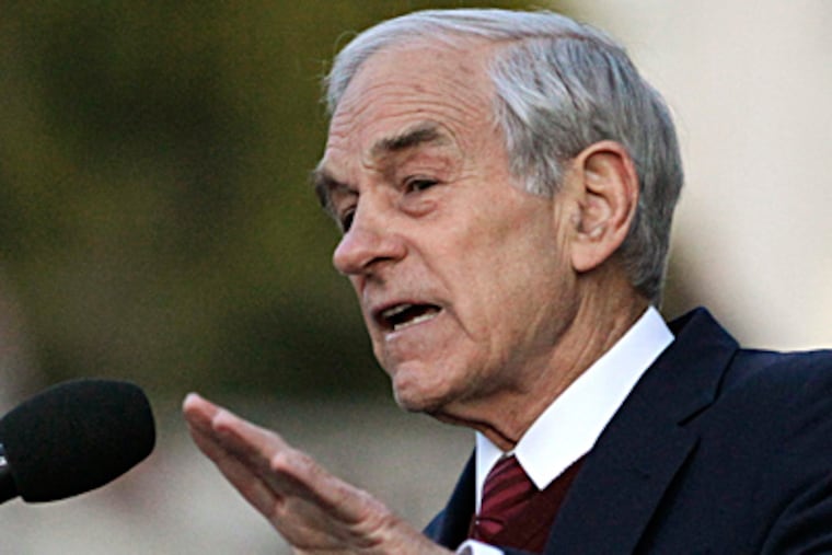 Ron Paul was among the leading vote-getters when online balloting was halted Tuesday. BEN MARGOT / AP