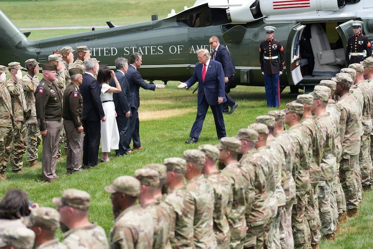 President Donald Trump greets Secretary of Defense Pete Hegseth as he arrives on Marine One at U.S. Army War College in Carlisle, Pa., on Wednesday, July 15, 2026. President Trump was traveling to a defense and innovation summit there.