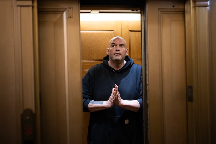 Sen. John Fetterman enters an elevator ahead of a vote on May 7 at the U.S. Capitol.