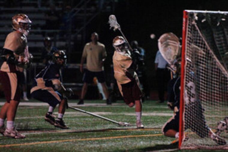 Haverford School's Rory O'Connor takes a shot against La Salle goalie Niko Amato. O'Connor scored a game-high four goals for the third-seeded Fords, but the second-seeded Explorers scored with one-tenth of second left in the second overtime to win.