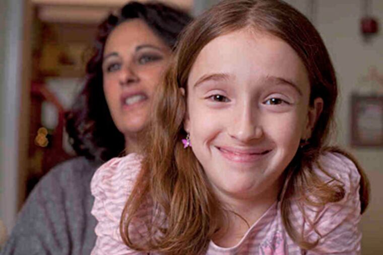 Mia Lisa Capuano had surgery before she was born with spina bifida and is an active 11-year-old. 'She is different because she had this surgery,' says her mother, Giovanna Capuano. (Ed Hille/Staff)