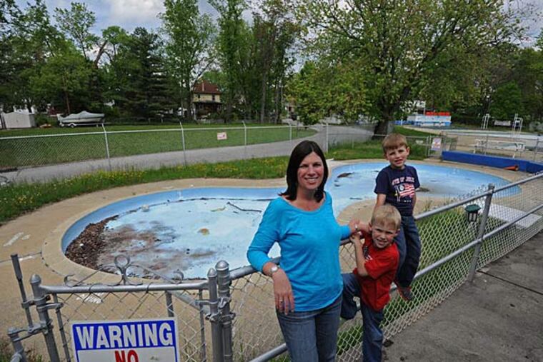 "We've been in difficulty for the past 10 years," says Sharon Brandley, president of the Oaklyn Swim Club, with her sons Shawn and Ryan.