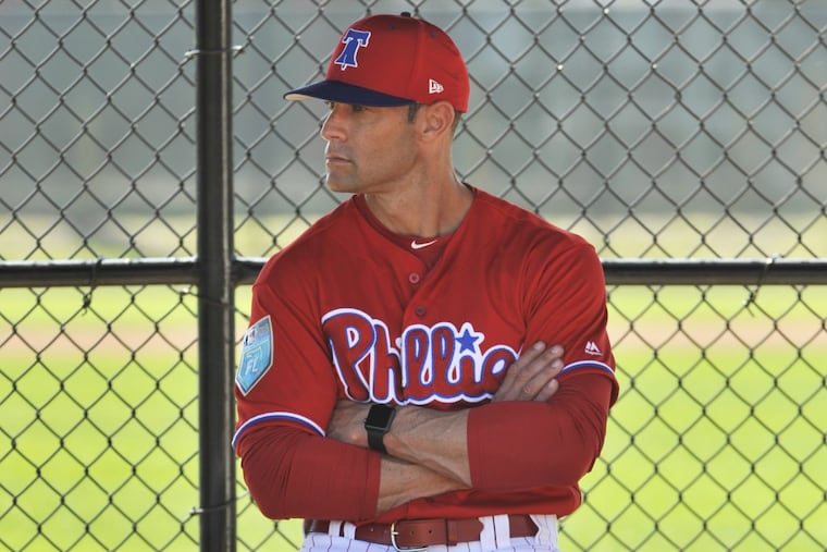 Phillies manager Gabe Kapler watches pitchers in the bullpen during workouts at the Phillies spring training complex on Thursday in Clearwater, Fla.