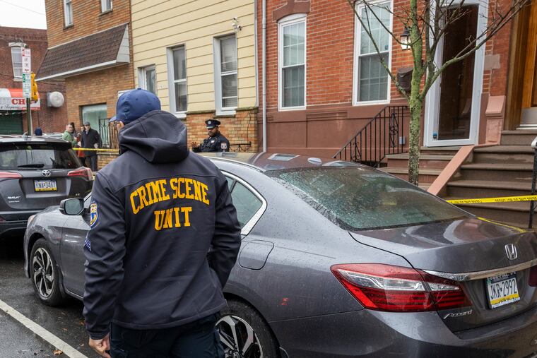 Philadelphia police and detectives hold the crime scene at a rowhouse on 1200 block of Snyder Avenue where a body was found in a freezer.