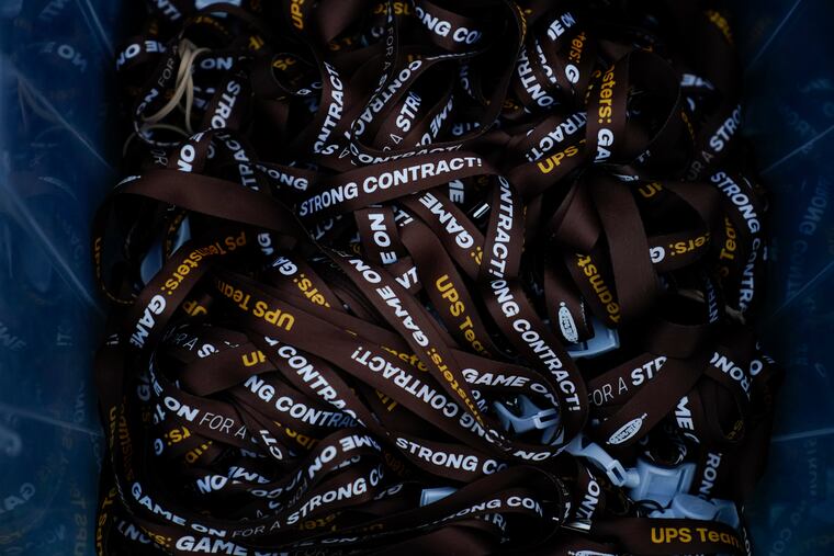 UPS lanyards are seen before a rally. The company has reached a contract agreement with its 340,000-person strong Teamsters union.