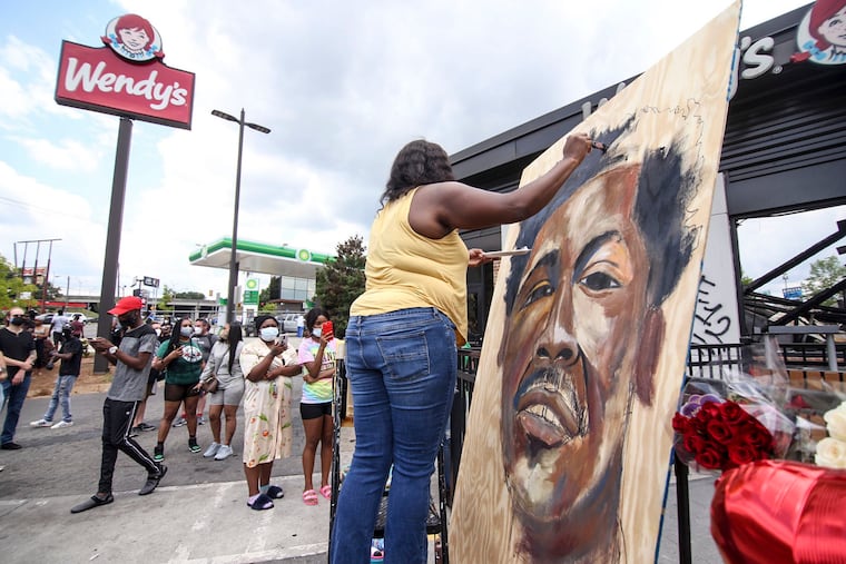 Ashley Dopson painted a picture of Rayshard Brooks in the parking lot of the Wendy's in Atlanta where Brooks, a 27-year-old black man, was shot and killed by Atlanta police.