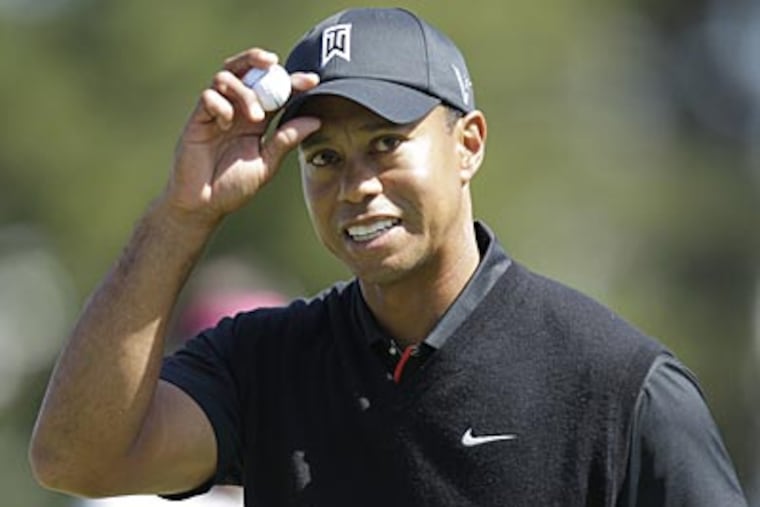 Tiger Woods reacts after making a birdie on the 10th hole during the
second round of the U.S. Open. (Ben Margot/AP)