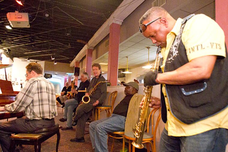 Saxophonist Glenn Williams solos at the jam session on June 2, 2015. ( CHARLES FOX / Staff Photographer )