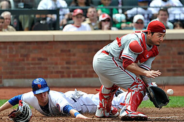 Jason Bay scores behind Phillies catcher Dane Sardinha in the second inning. (AP Photo/Kathy Kmonicek)